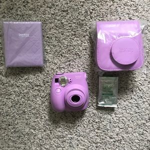 Polaroid Camera + case, strap, photo book and more